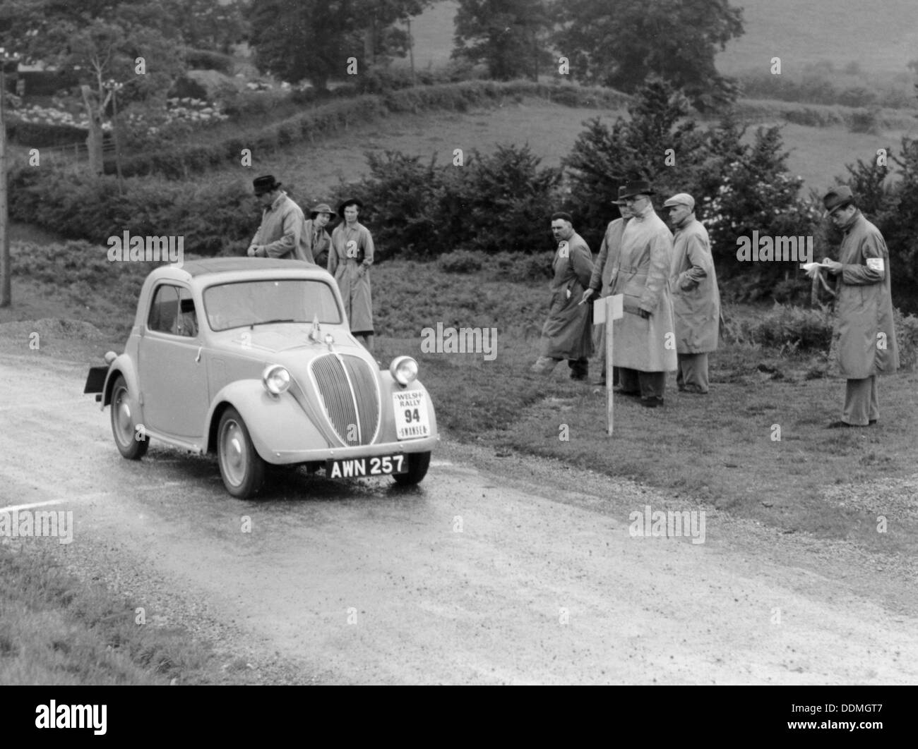 1937 Fiat 500 Coupe competing in the Welsh Rally. Artist: Unknown Stock Photo