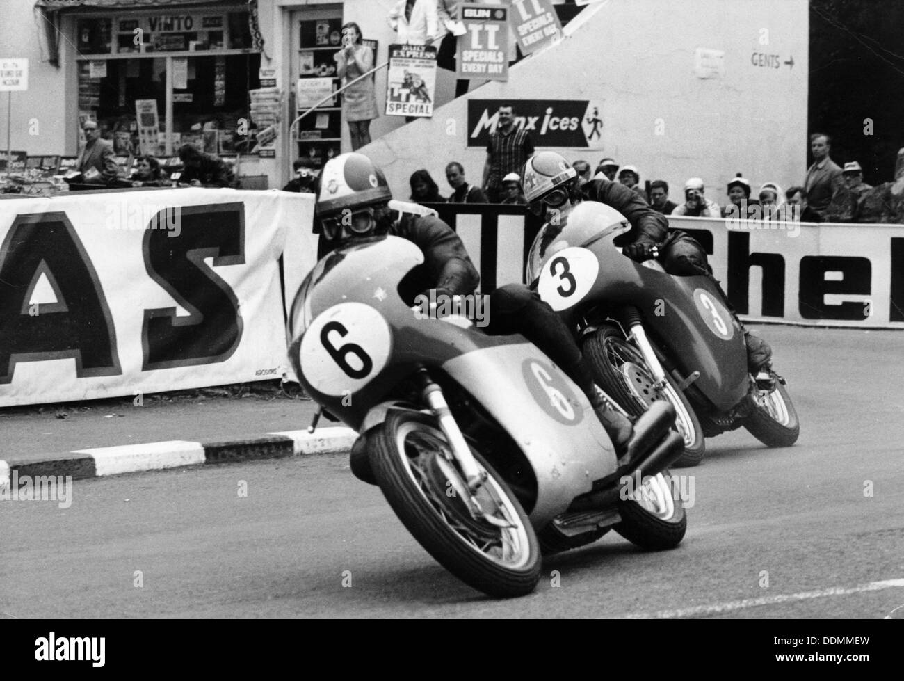 Giacomo Agostini on bike number 6, Tom Dickie on bike number 3, Isle of Man Junior TT, 1968. Artist: Unknown Stock Photo