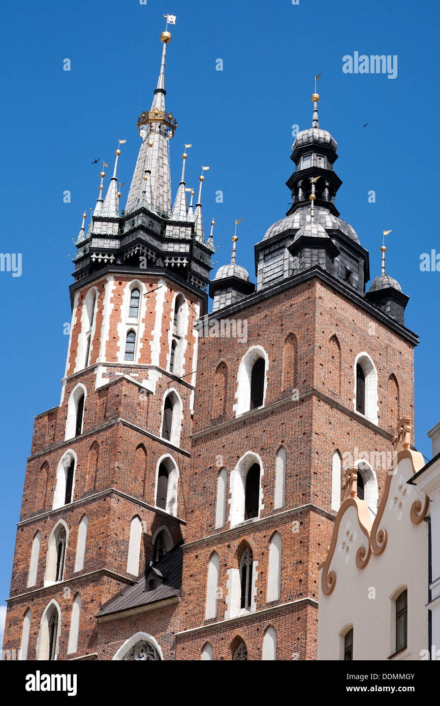 closeup two towers of St. Mary Basilica, market square Krakow, Poland Stock Photo