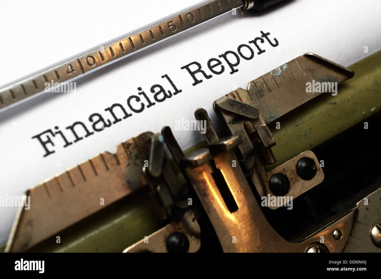 Financial report text on typing machine Stock Photo - Alamy