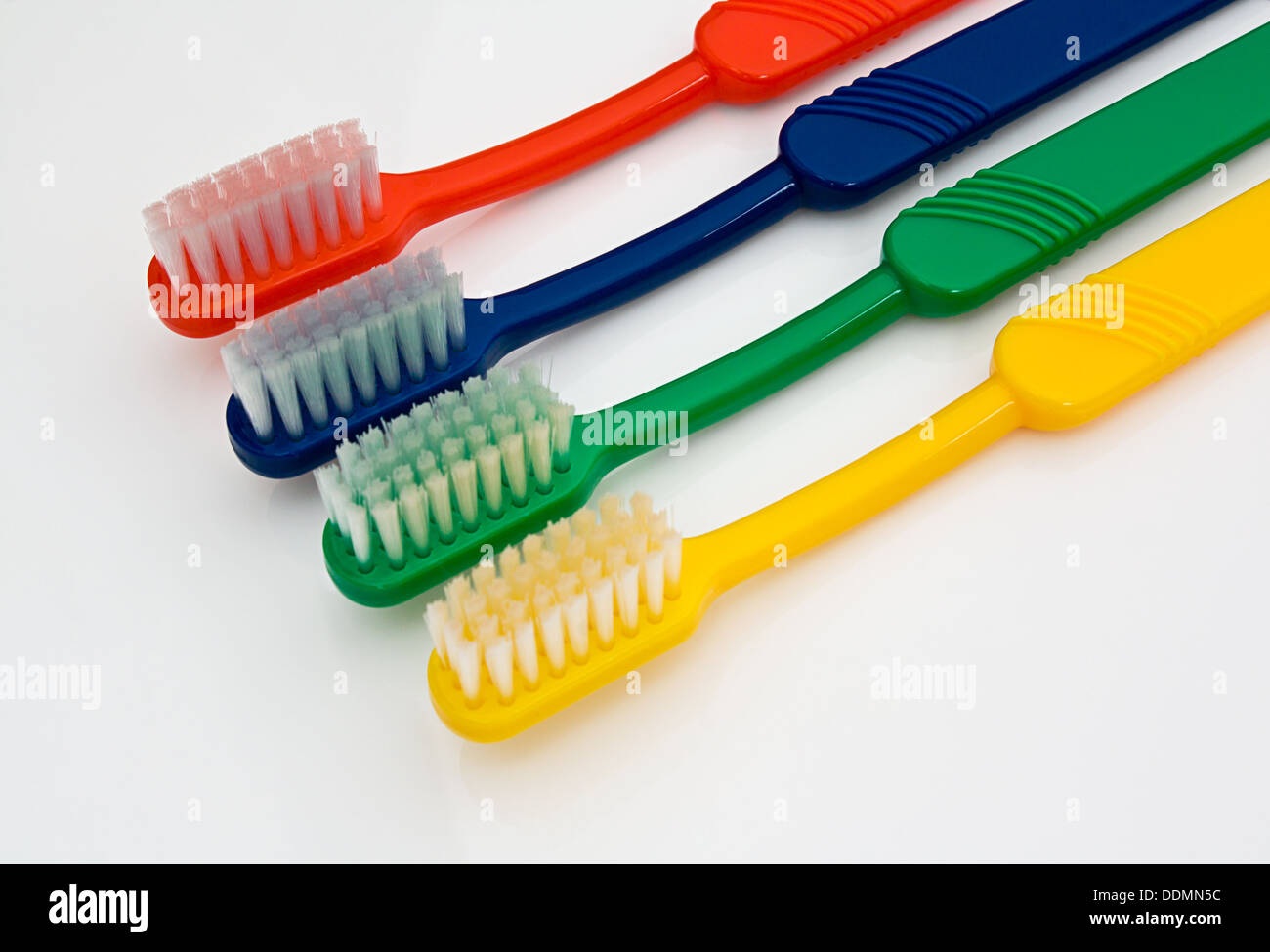 Different colored toothbrushes Stock Photo