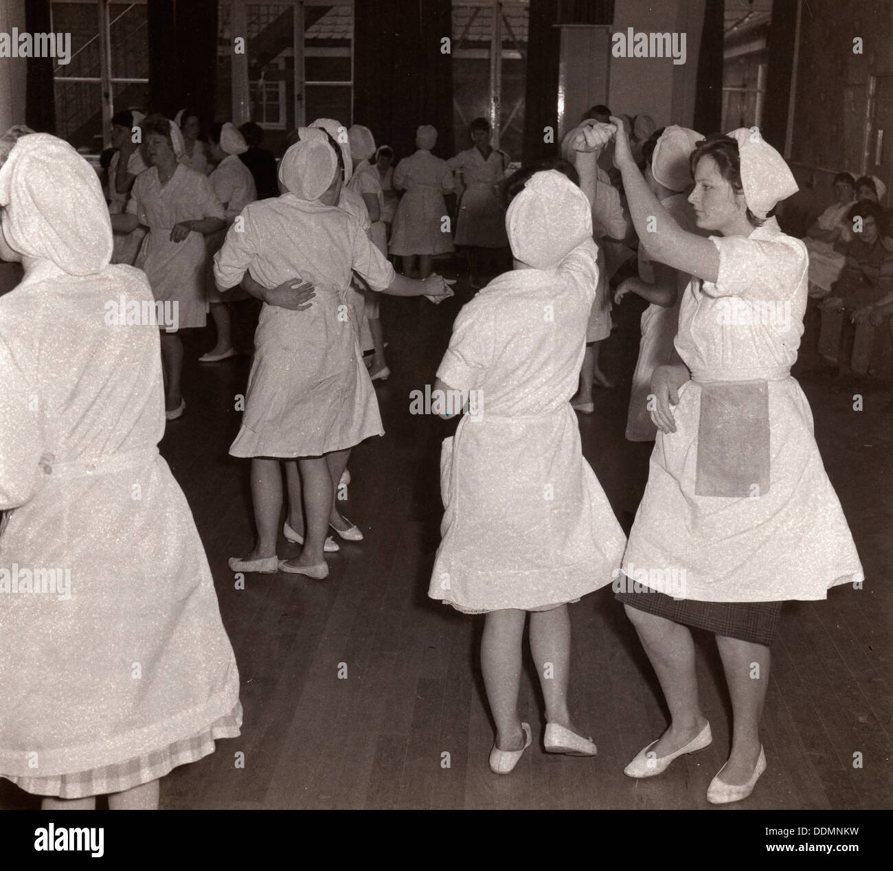 Women employees at Rowntrees Rock and Roll in their work clothes, York, Yorkshire, 1961. Artist: Unknown Stock Photo
