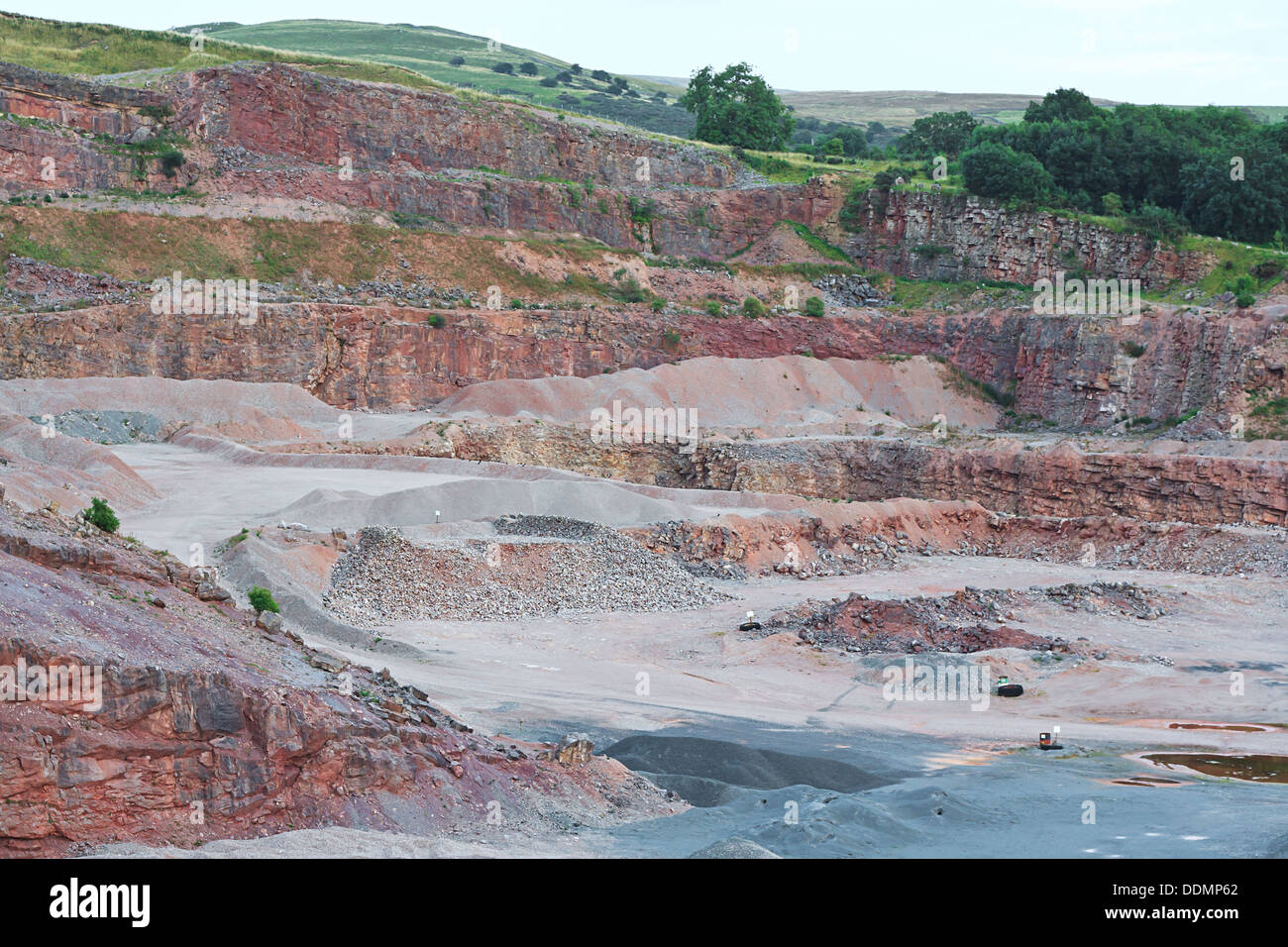 general shot of the inside of a sandstone quarry showing the rock face and levels of excavation Stock Photo