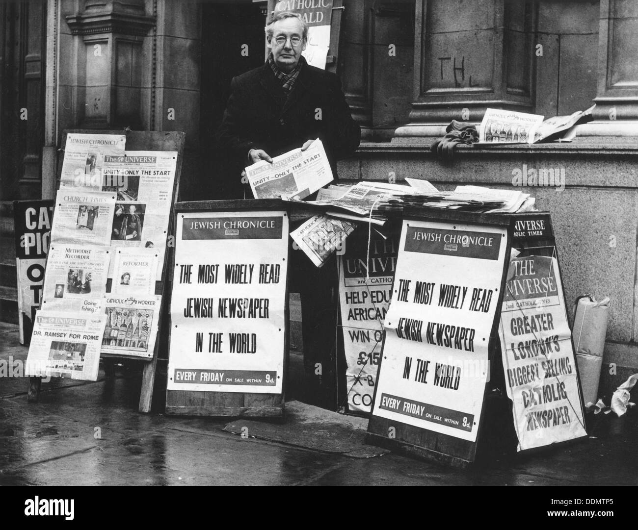 The Jewish Chronicle on sale outside Westminster Cathedral, London, 1966. Artist: EH Emanuel Stock Photo