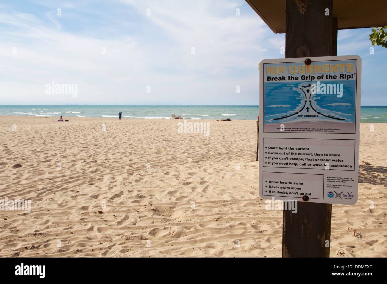 Rip current warning sign. Indiana Dunes State Park. Stock Photo