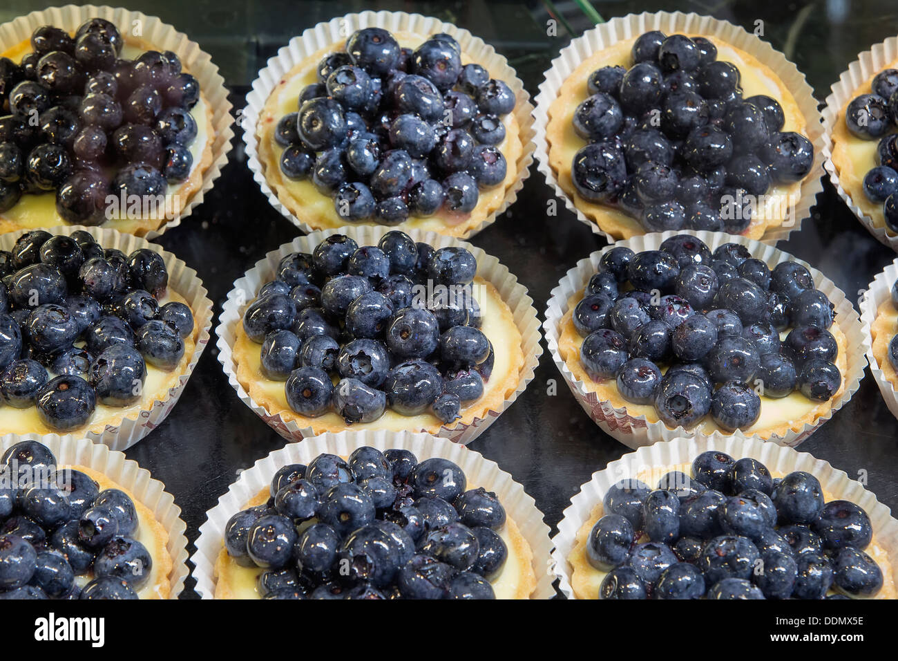 Lemon Curd Fruit Tarts with Blueberries at Bakery Shop Stock Photo