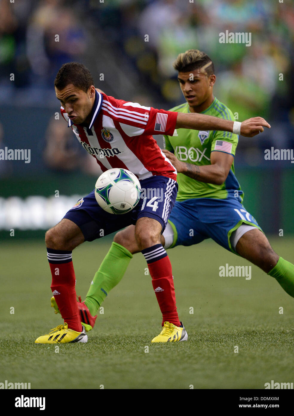 Seattle, Washington, USA. 04th Sep, 2013. Seattle Sounders FC defender DeAndre Yedlin #17 and Chivas USA forward Giovani Casillas #14 battle in action at CenturyLink Field in Seattle, WA. Seattle Sounders FC defeats Chivas USA 1 - 0 .George Holland / Cal Sport Media Credit:  Cal Sport Media/Alamy Live News Stock Photo
