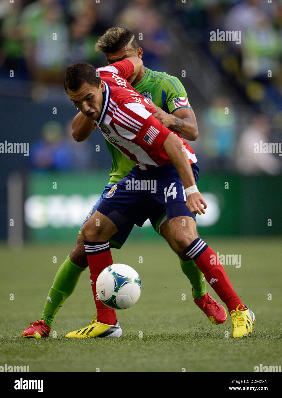 Seattle, Washington, USA. 04th Sep, 2013. Seattle Sounders FC defender DeAndre Yedlin #17 and Chivas USA forward Giovani Casillas #14 battle in action at CenturyLink Field in Seattle, WA. Seattle Sounders FC defeats Chivas USA 1 - 0 .George Holland / Cal Sport Media Credit:  Cal Sport Media/Alamy Live News Stock Photo