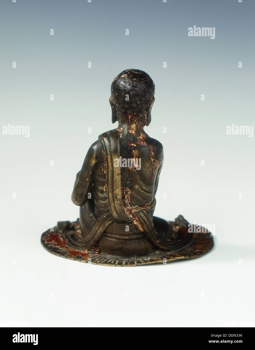 Gilt bronze statue of a lohan seated on a rush mat, late Ming dynasty, China, 1600-1644. Artist: Unknown Stock Photo