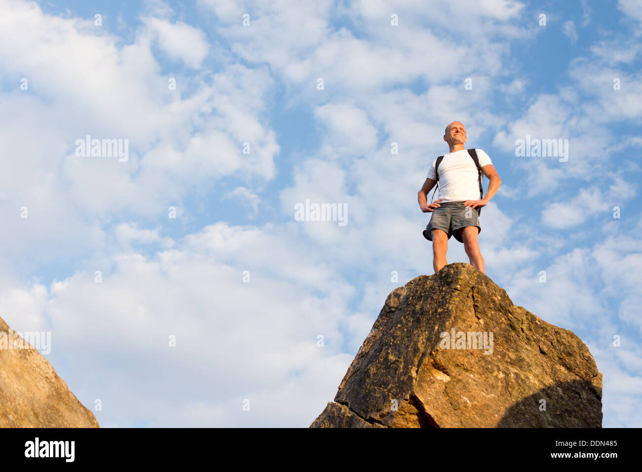 Guy standing on mountain peak hi-res stock photography and images - Alamy