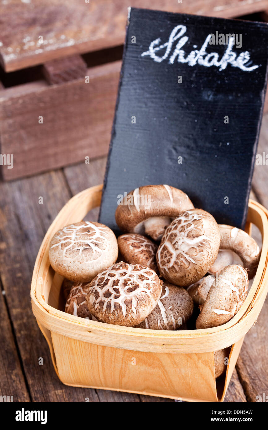 Prepacked mushrooms in a punnet covered with clear plastic