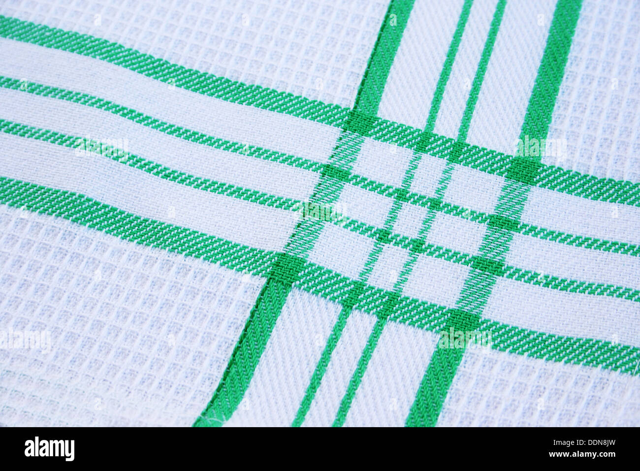 Texture of white and green cotton fabric as abstract background. Stock Photo