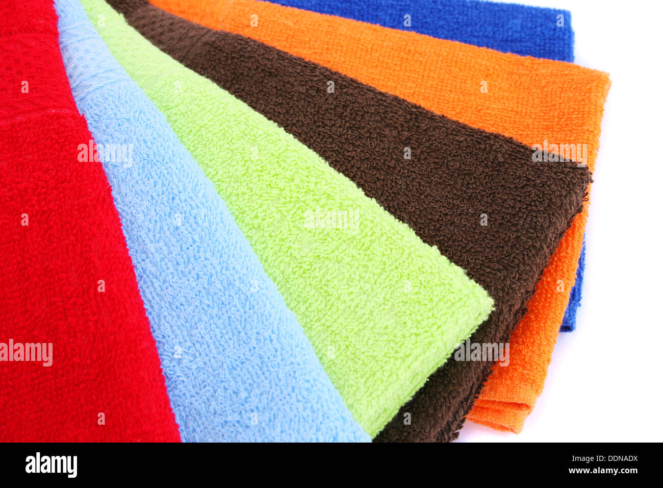 Colorful towels on white background. Stock Photo