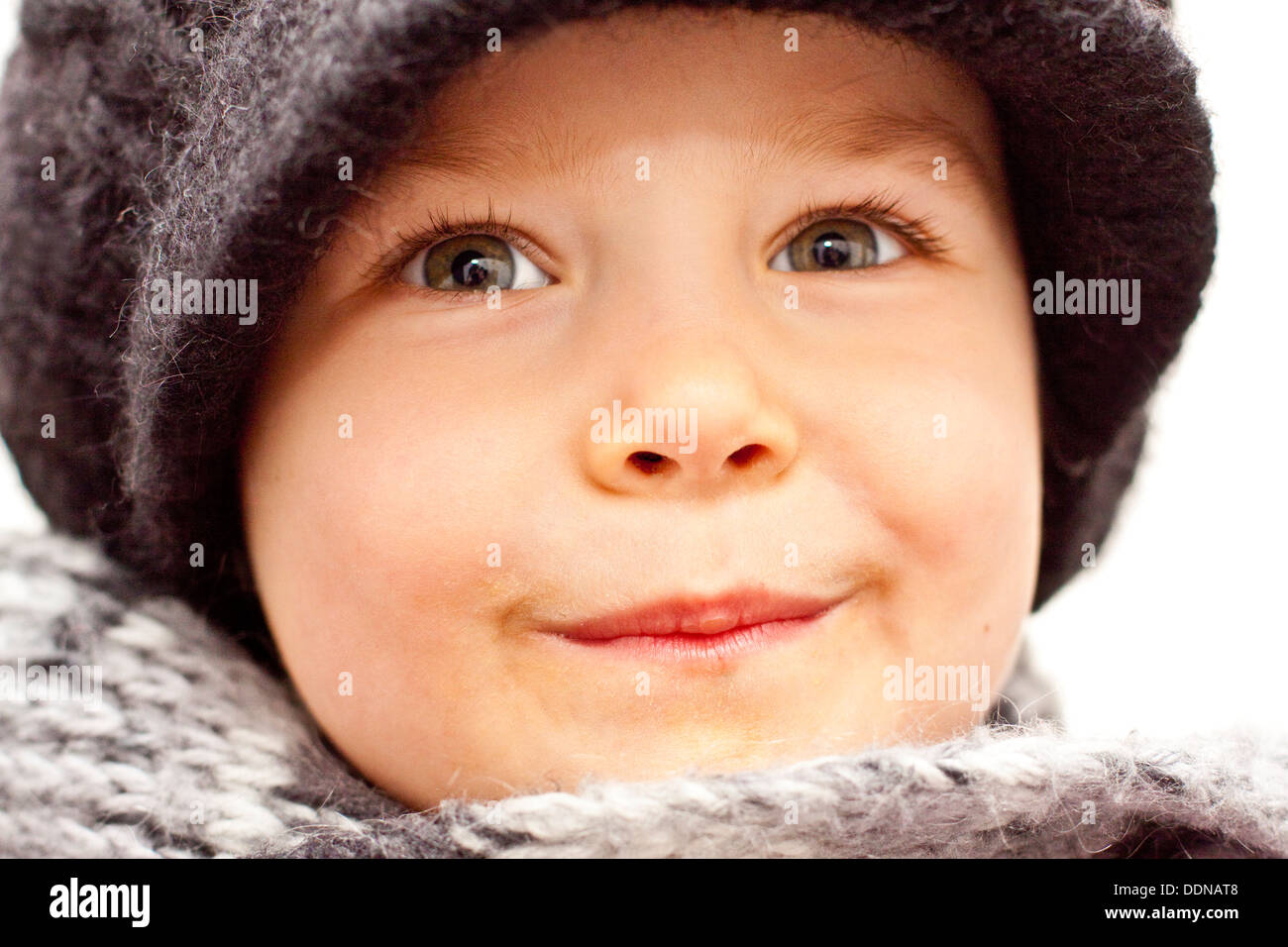 Toddler wearing wooly hat and scarf Stock Photo
