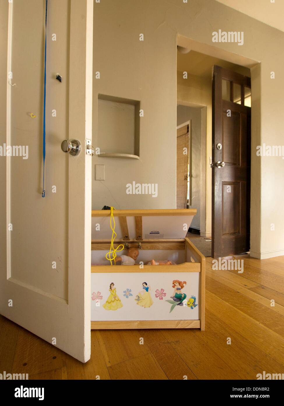 A Chest Of Toys Remains In An Empty Room Inside A Foreclosed