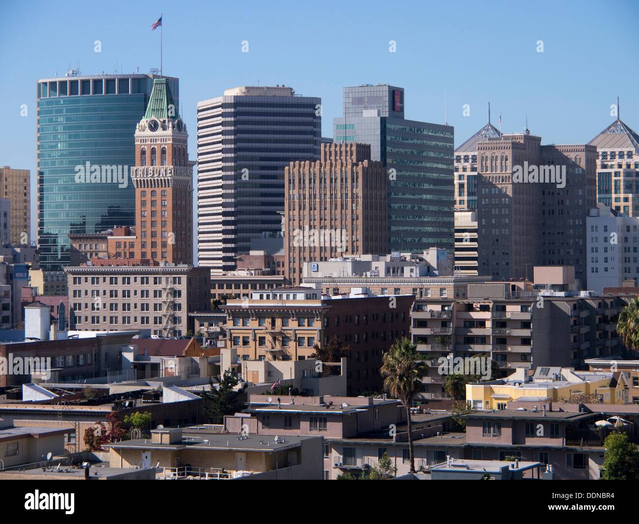 Bright sunlight hits downtown skyrises and apartment buildings in