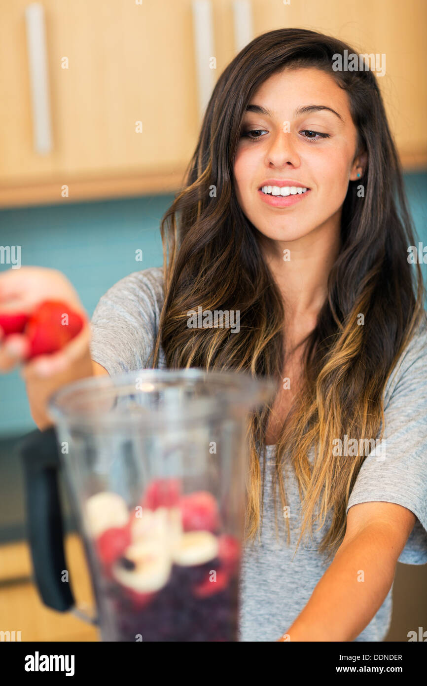 Beautiful Young Woman Making Fruit Smoothie in Blender Stock Photo Alamy