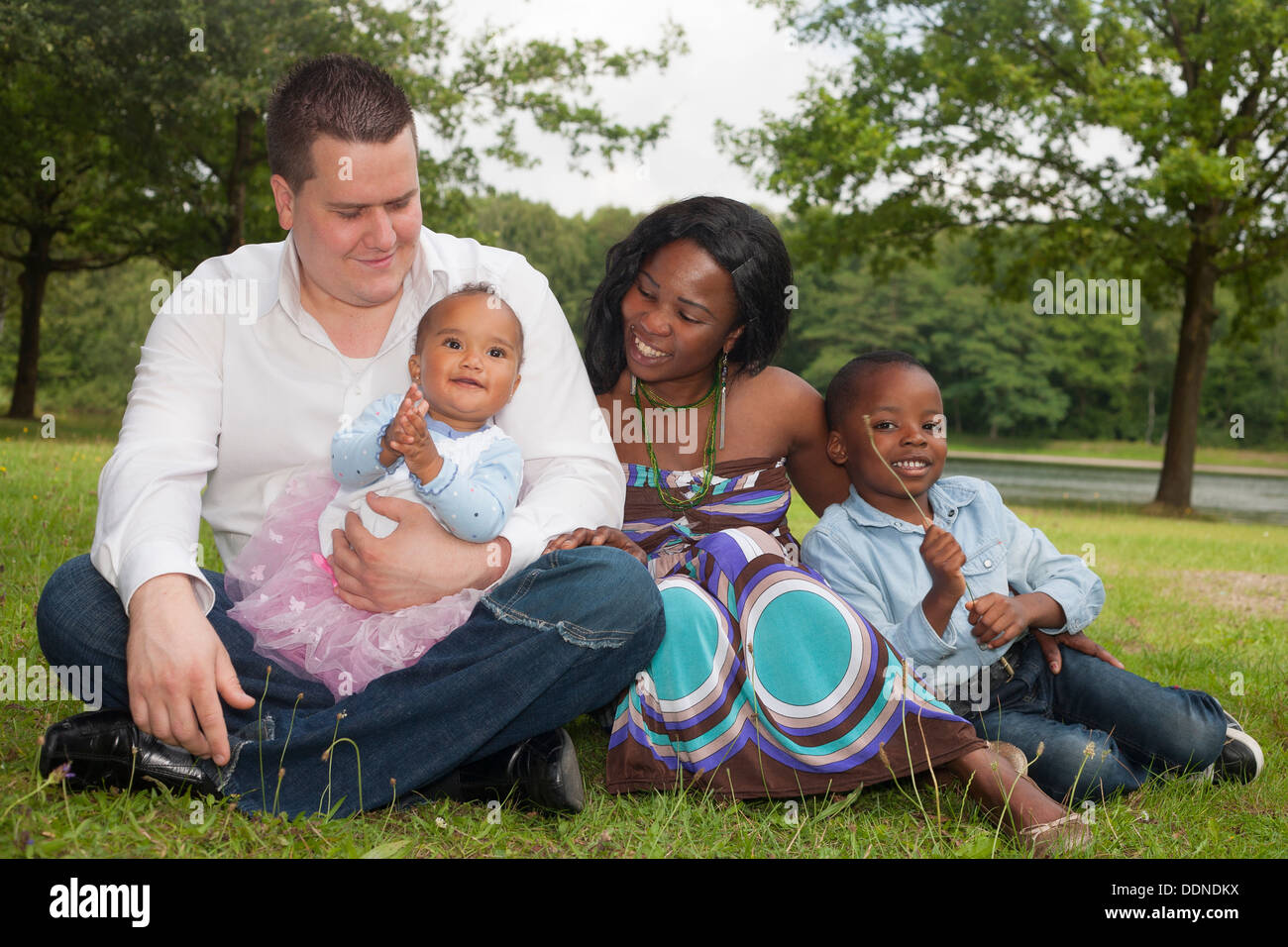 Happy mixed family is having a nice day in the park Stock Photo