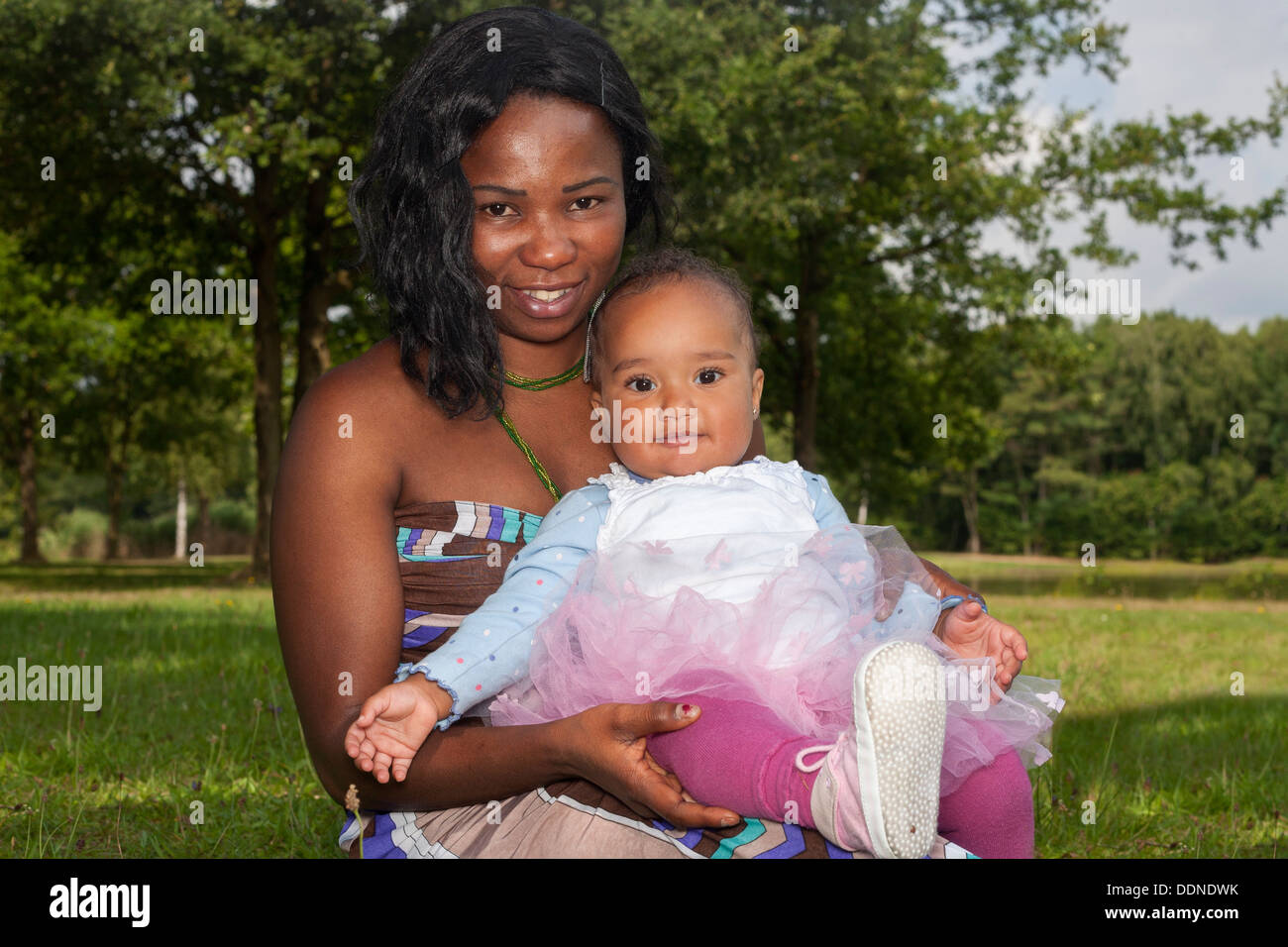 Happy mixed family is having a nice day in the park Stock Photo