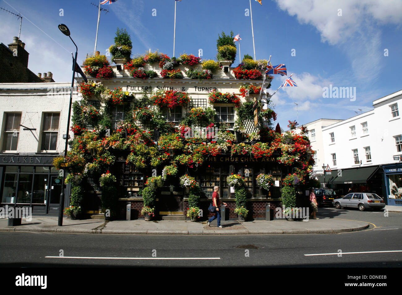 Flowerfestooned Churchill Arms pub on Kensington Church Street