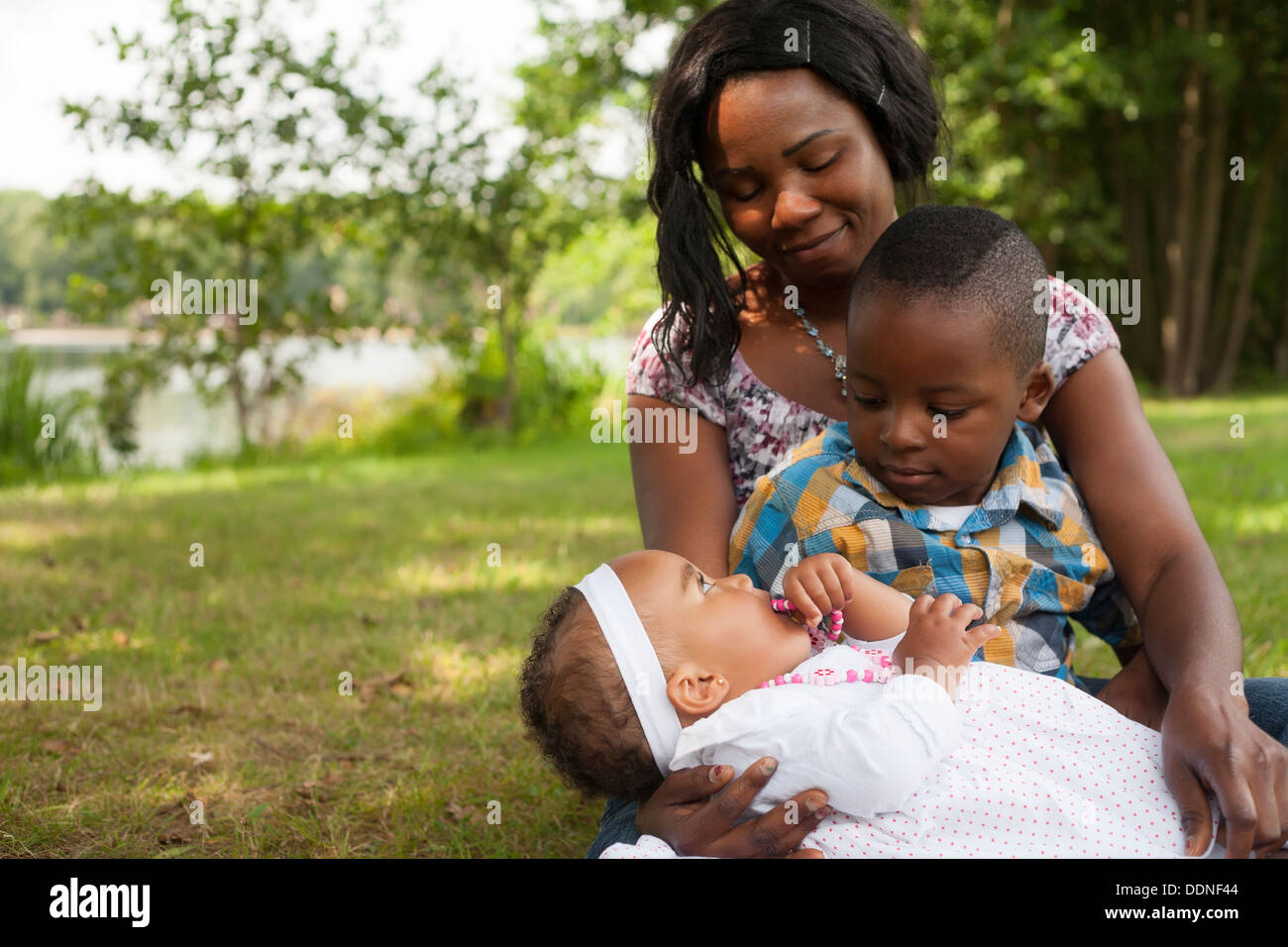 Happy mixed family is having a nice day in the park Stock Photo