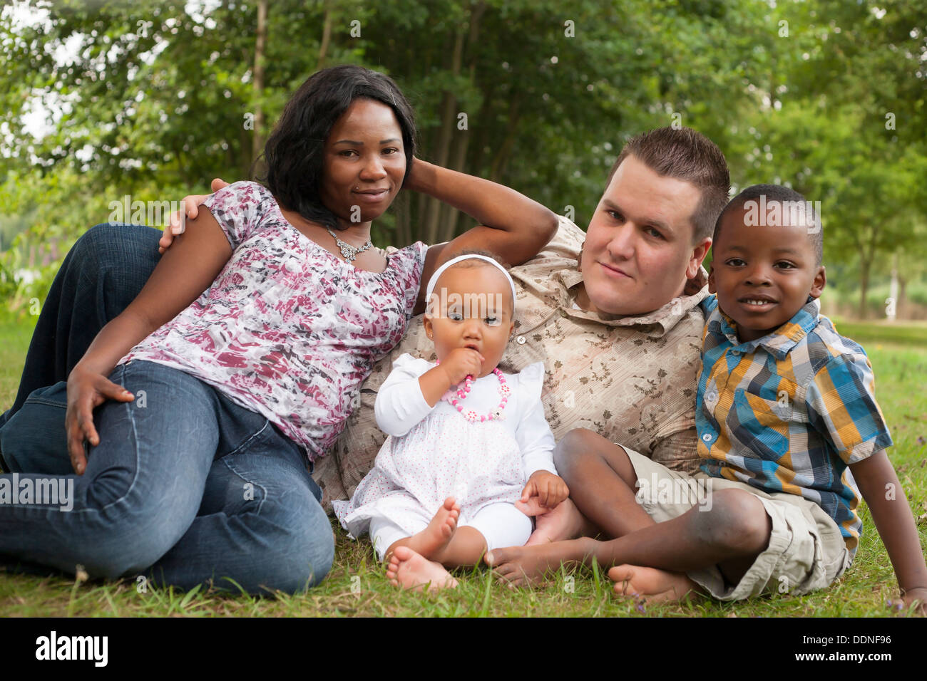 Happy mixed family is having a nice day in the park Stock Photo