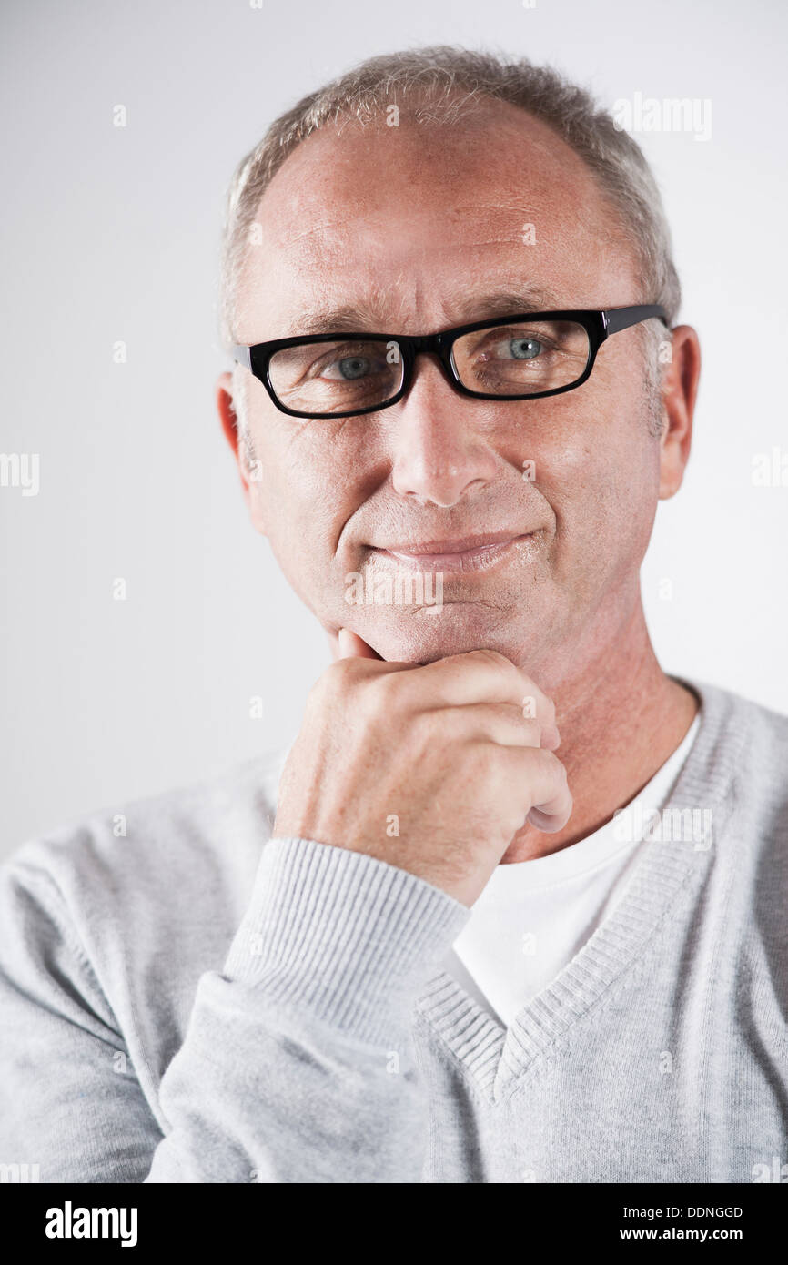 Grey haired man wearing glasses hi-res stock photography and images - Alamy