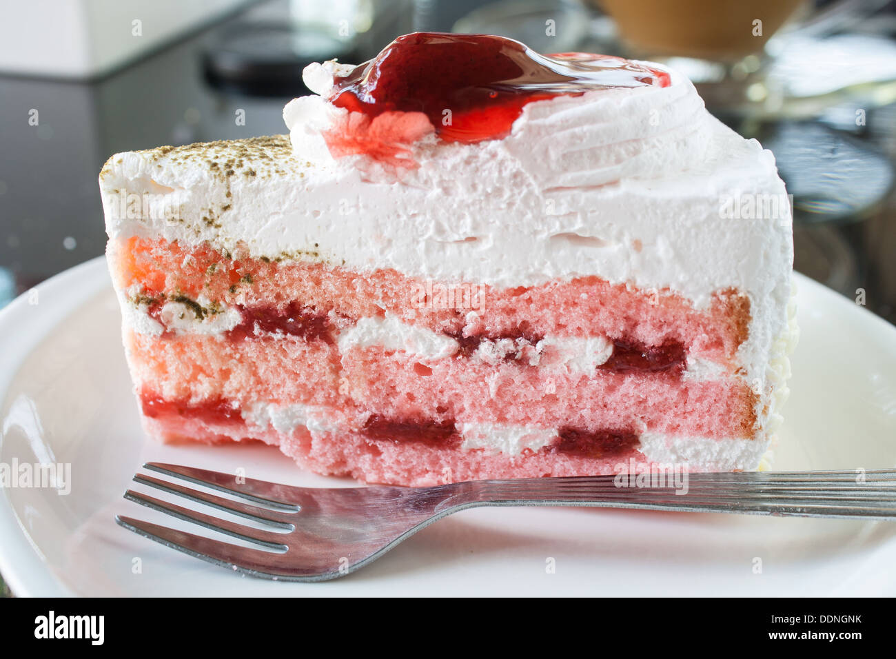 Strawberry cake with fork on white dish Stock Photo - Alamy