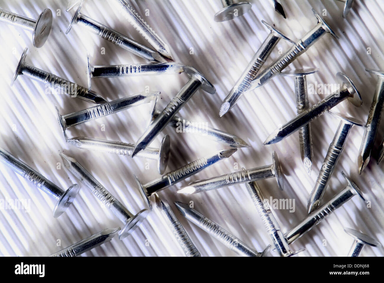 Many roofing nails on corrugated surface Stock Photo Alamy