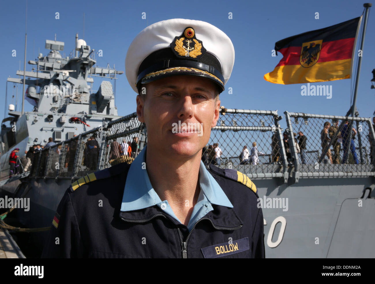 Rostock-Warnemuende, Germany. 05th Sep, 2013. Commander Boris Bollow is seen in front of hid corvette 'Braunschweig' after arriving at the home port in Rostock-Warnemuende, Germany, 05 September 2013. The corvette 'Braunschweig' with 60 soldiers on board returned from a five month Unifil mission at the Lebanese coast. Photo: BERND WUESTNECK/dpa/Alamy Live News Stock Photo