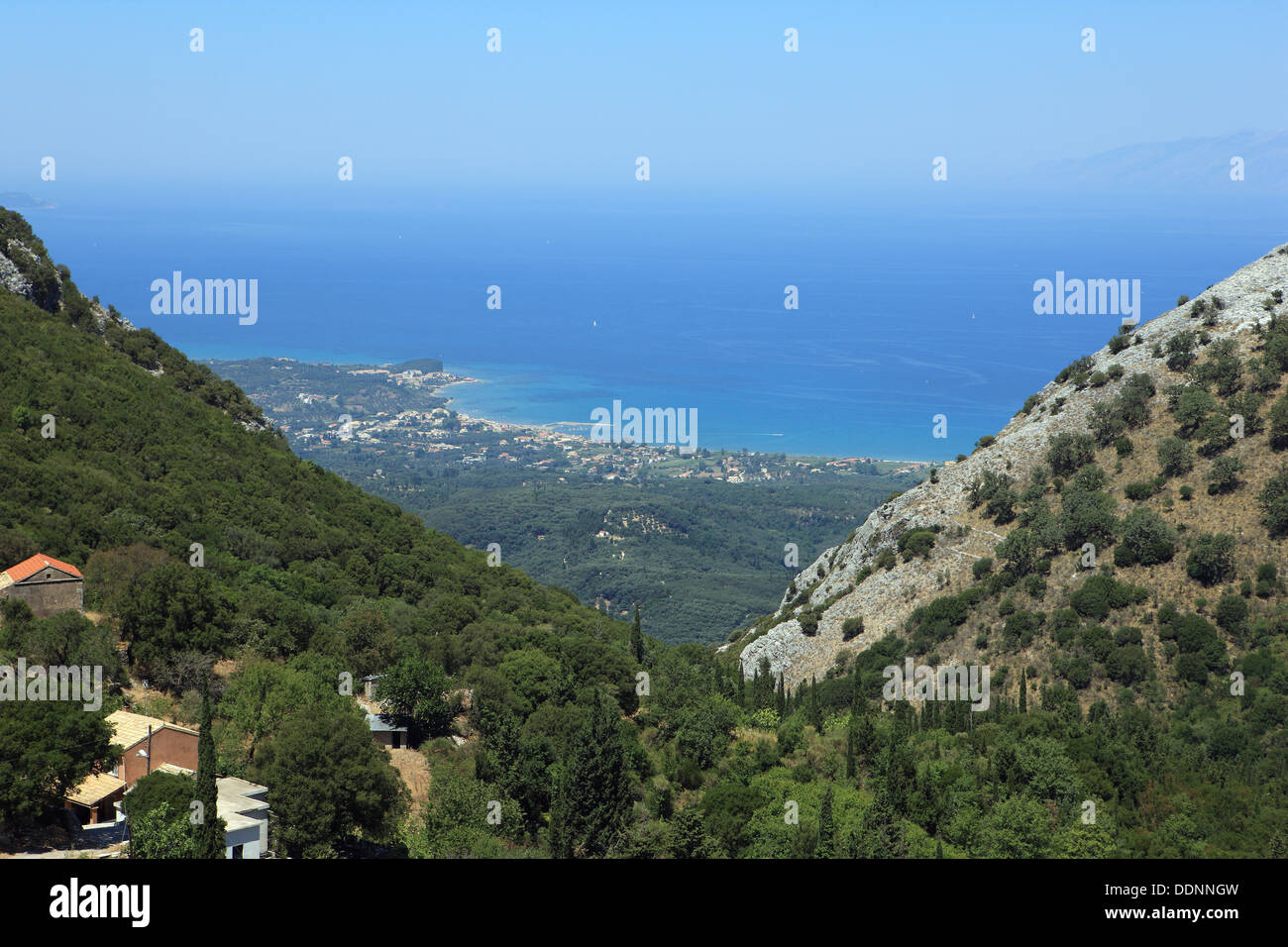 View from the slopes of Mount Pantokrator over the Corfu towns of Agnos, Roda, Ag Stafanos and Acharavi and far away,  Albania Stock Photo