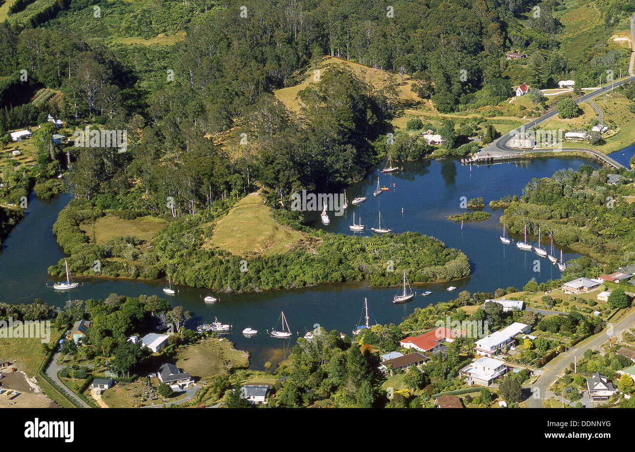 Kerikeri Inlet lined by yachts and old Stone Store aerial view New