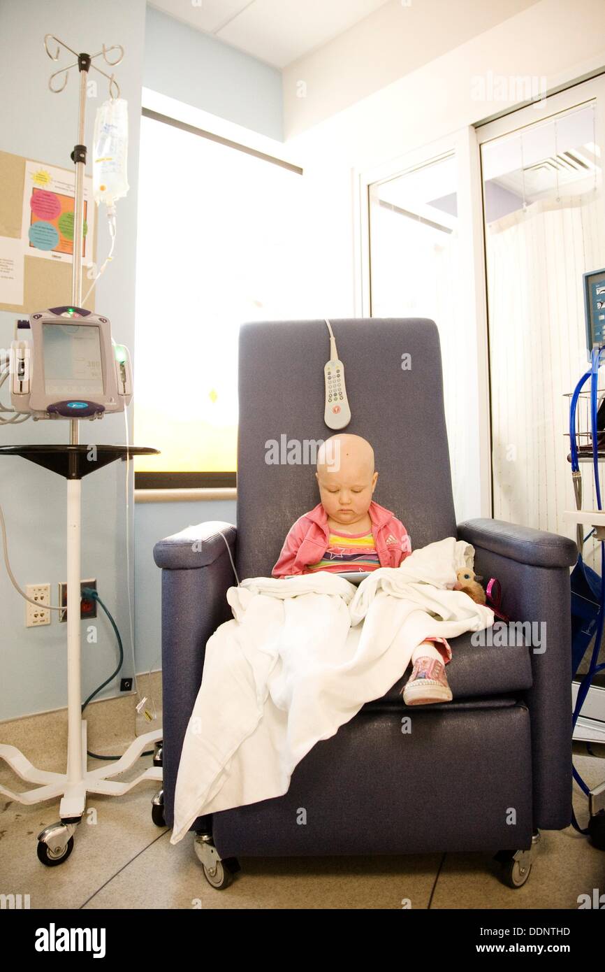 Portrait of a young girl with pediatric cancer leukimia sitting in an