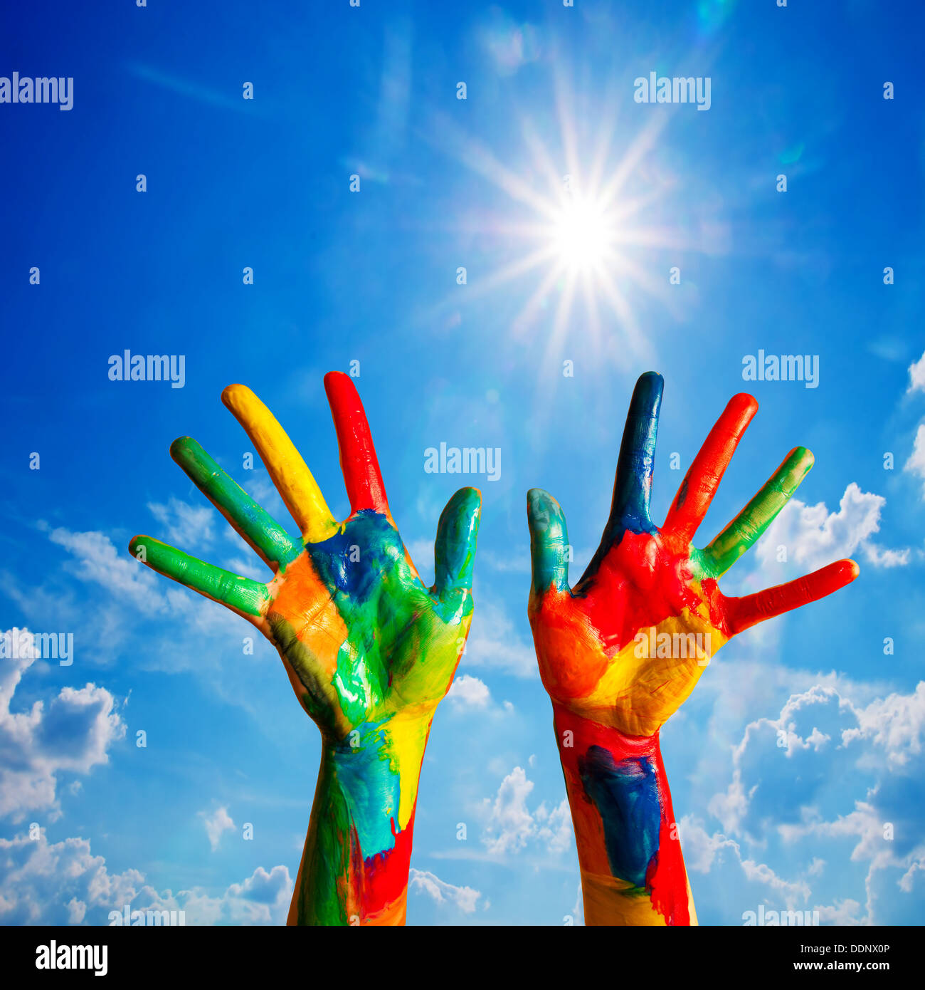 Painted hands up, colorful fun - creativity / happiness / diversity concept. Stock Photo