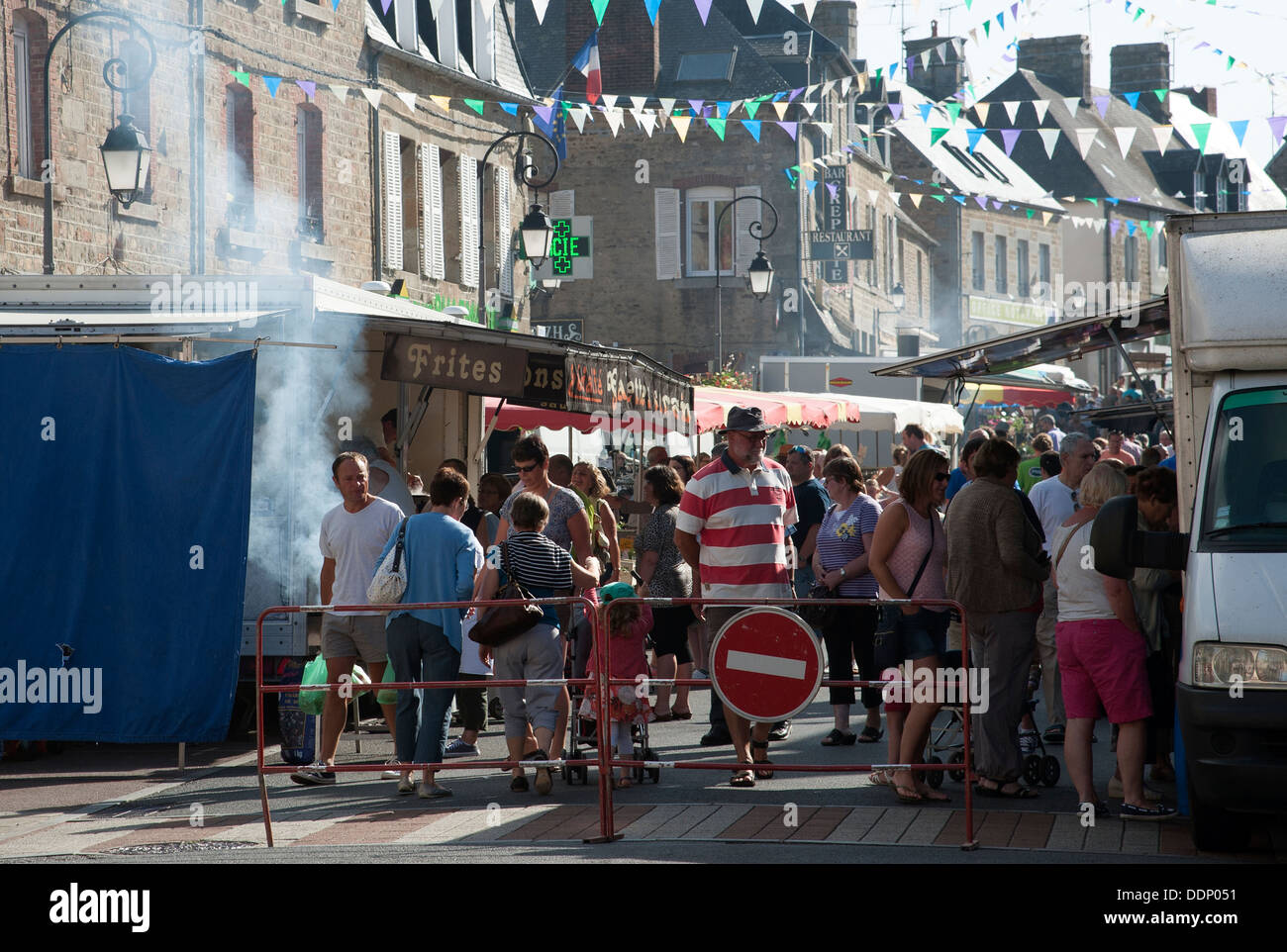 Weekly street market selling a variety of goods and food in Ducey town centre Normandy France Stock Photo