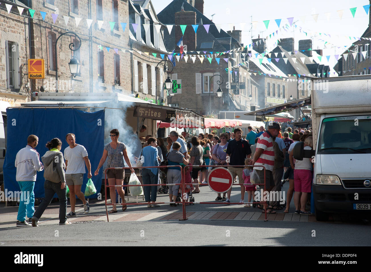 Weekly street market selling a variety of goods and food in Ducey town centre Normandy France Stock Photo