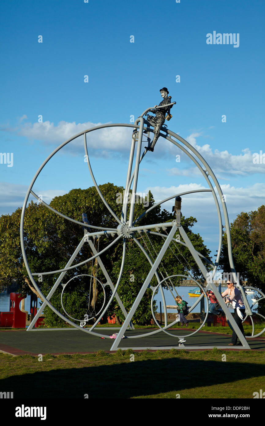 Giant penny-farthing swing at harbourside playground, Oamaru, North Otago, South Island, New Zealand Stock Photo