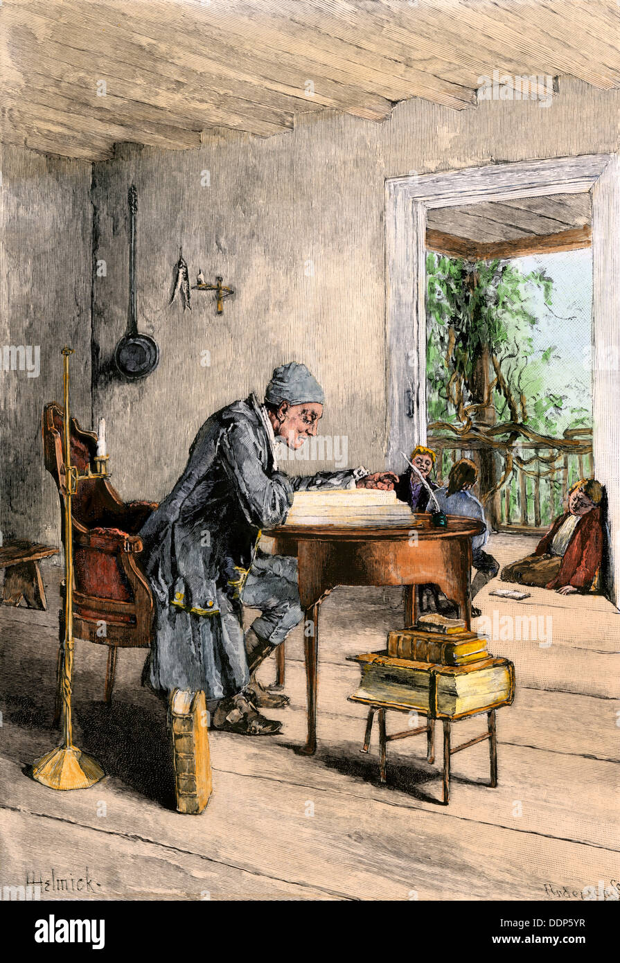 Schoolmaster reading at his desk in a colonial classroom. Hand-colored woodcut Stock Photo