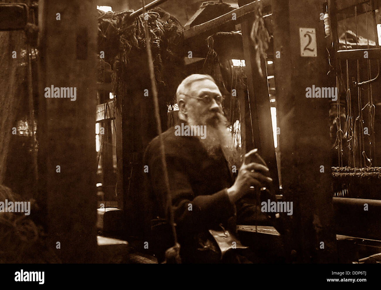 Hand loom weaver early 1900s Stock Photo - Alamy