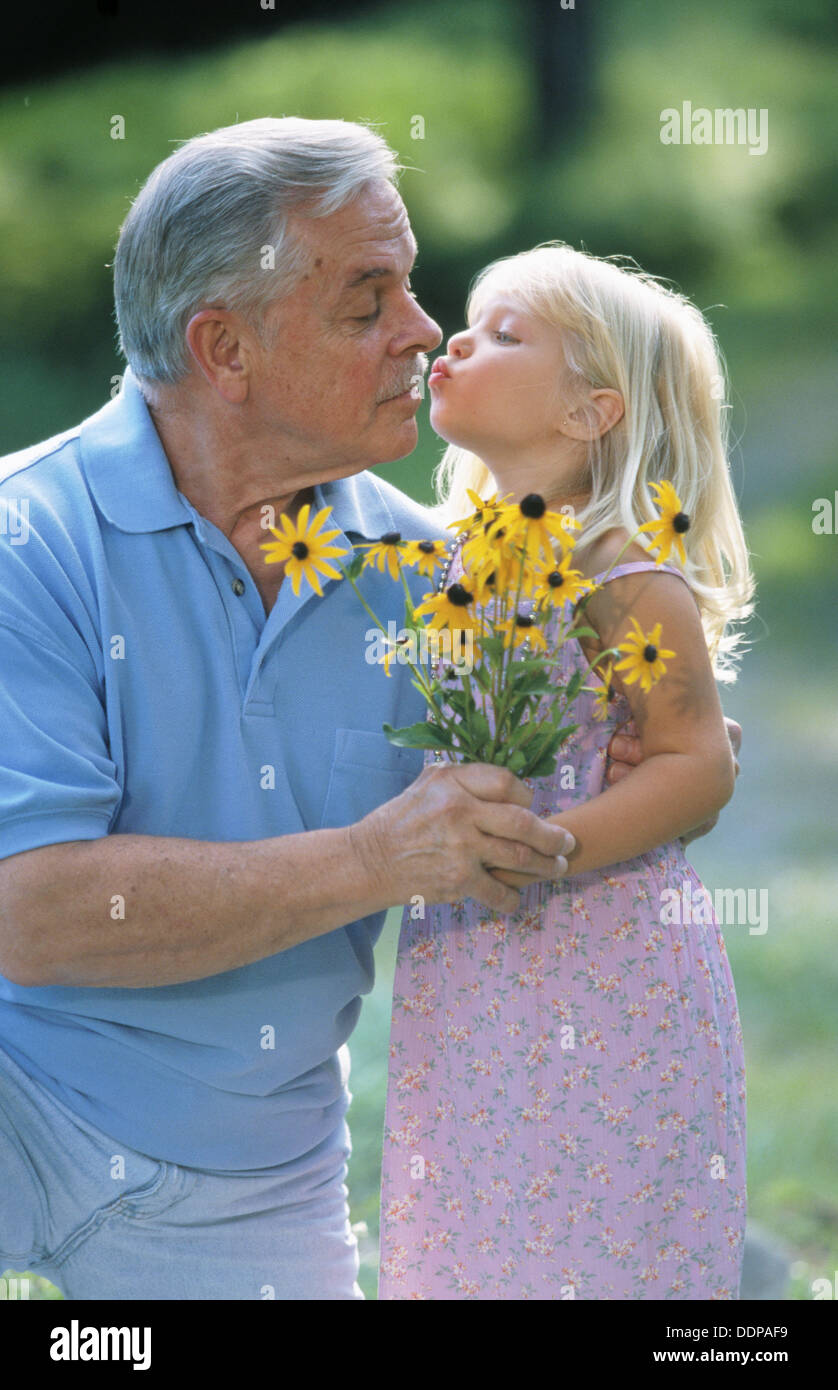 Grandpa gets a kiss Stock Photo - Alamy