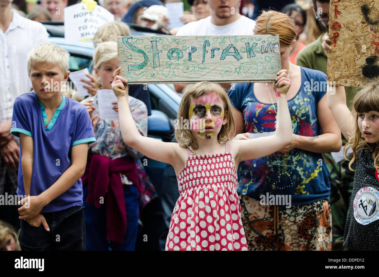 Young girl holding sign at 'Belt It Out Balcombe' event, Balcombe, West Sussex, for the anti-fracking campaign, 11th August 2013 Stock Photo