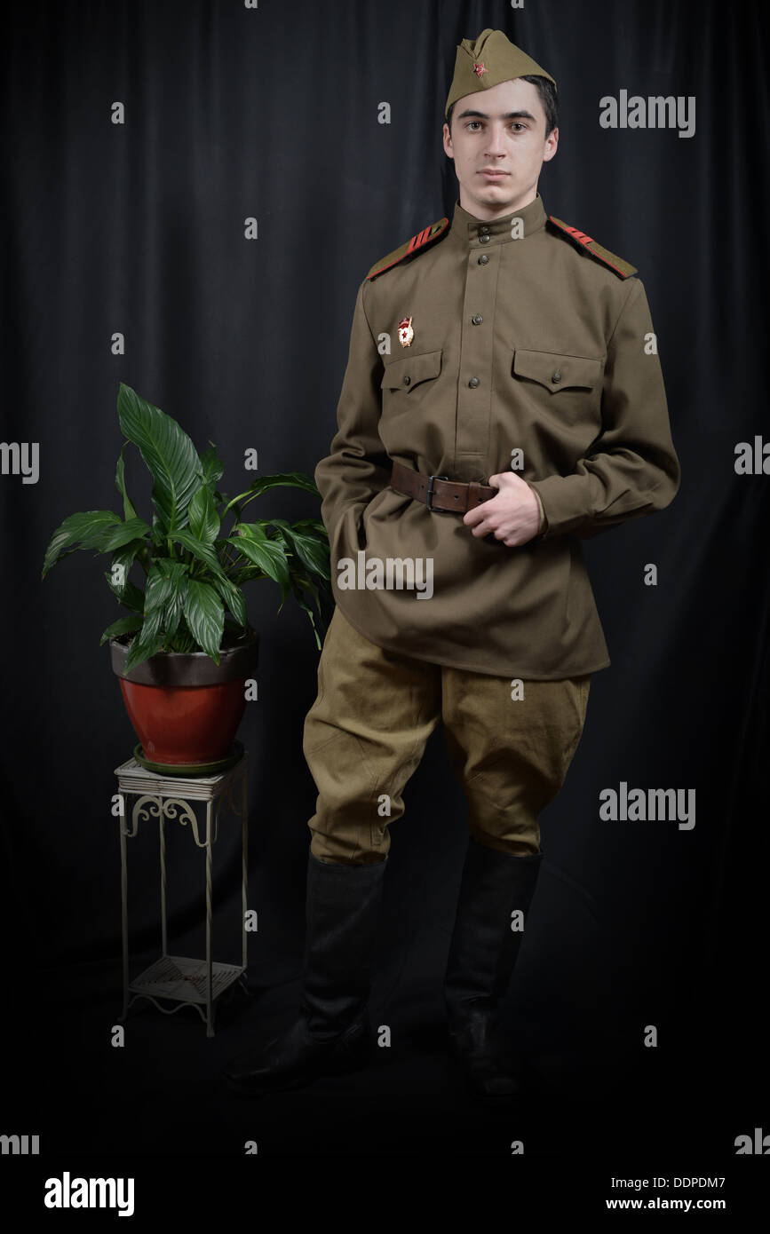 a young soviet soldier in the photographic studio Stock Photo