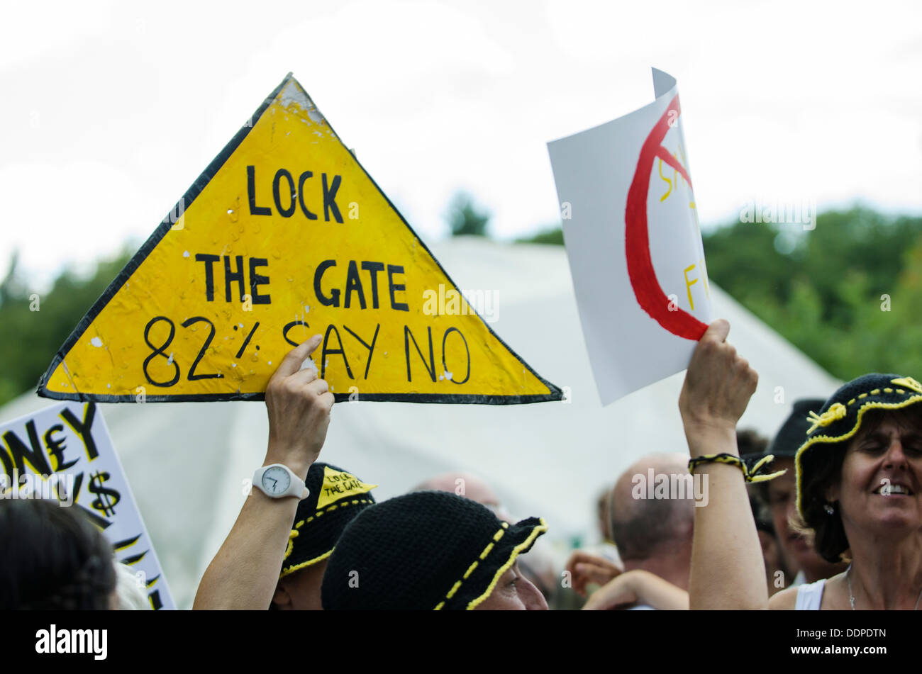'LOCK THE GATE - 82% SAY NO' sign being held up during Belt It Out Balcombe event at Balcombe, West Sussex, for the anti-fracking campaign, 11th August 2013 Stock Photo