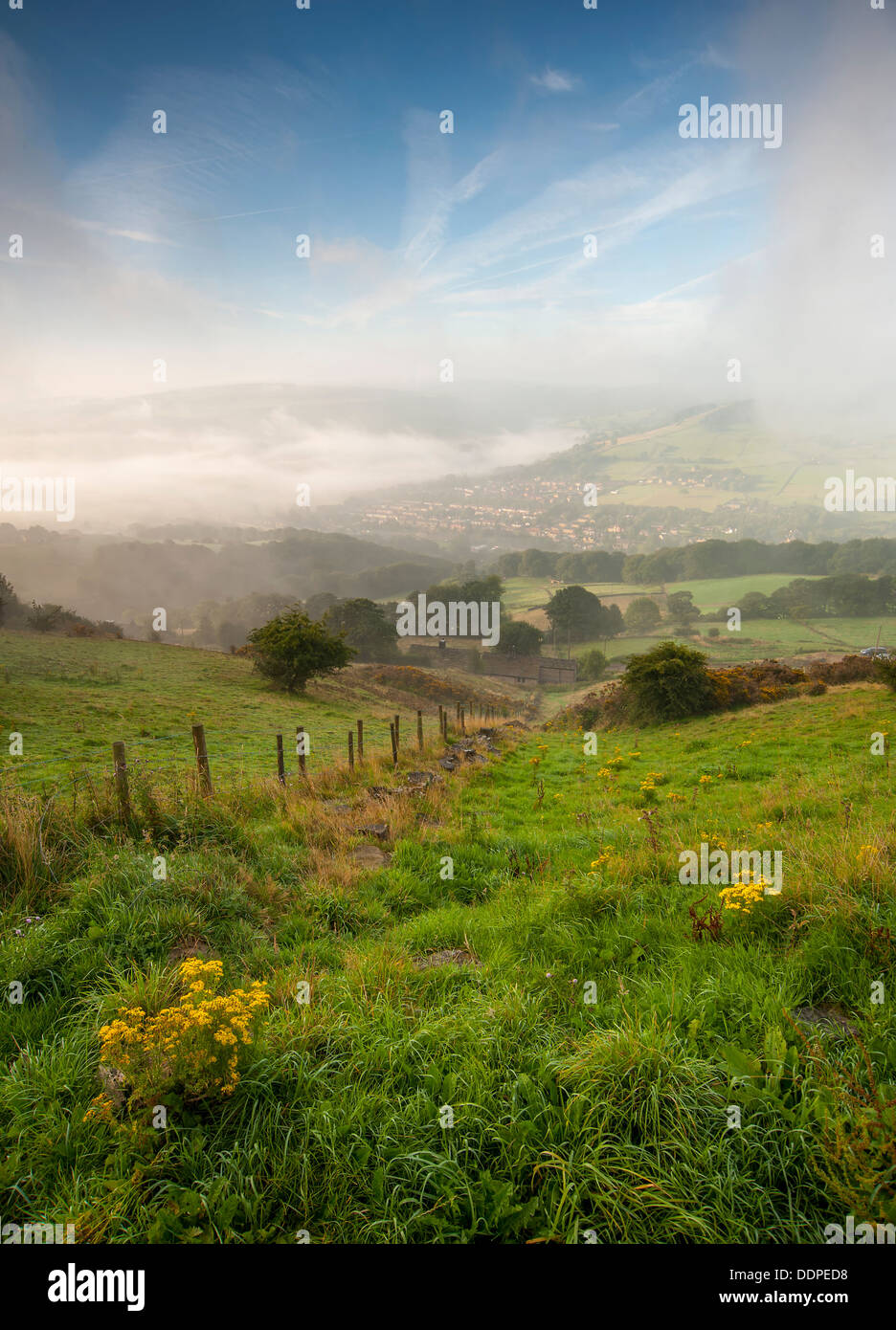 Mist and fog combined along a deep valley in West Yorkshire Stock Photo