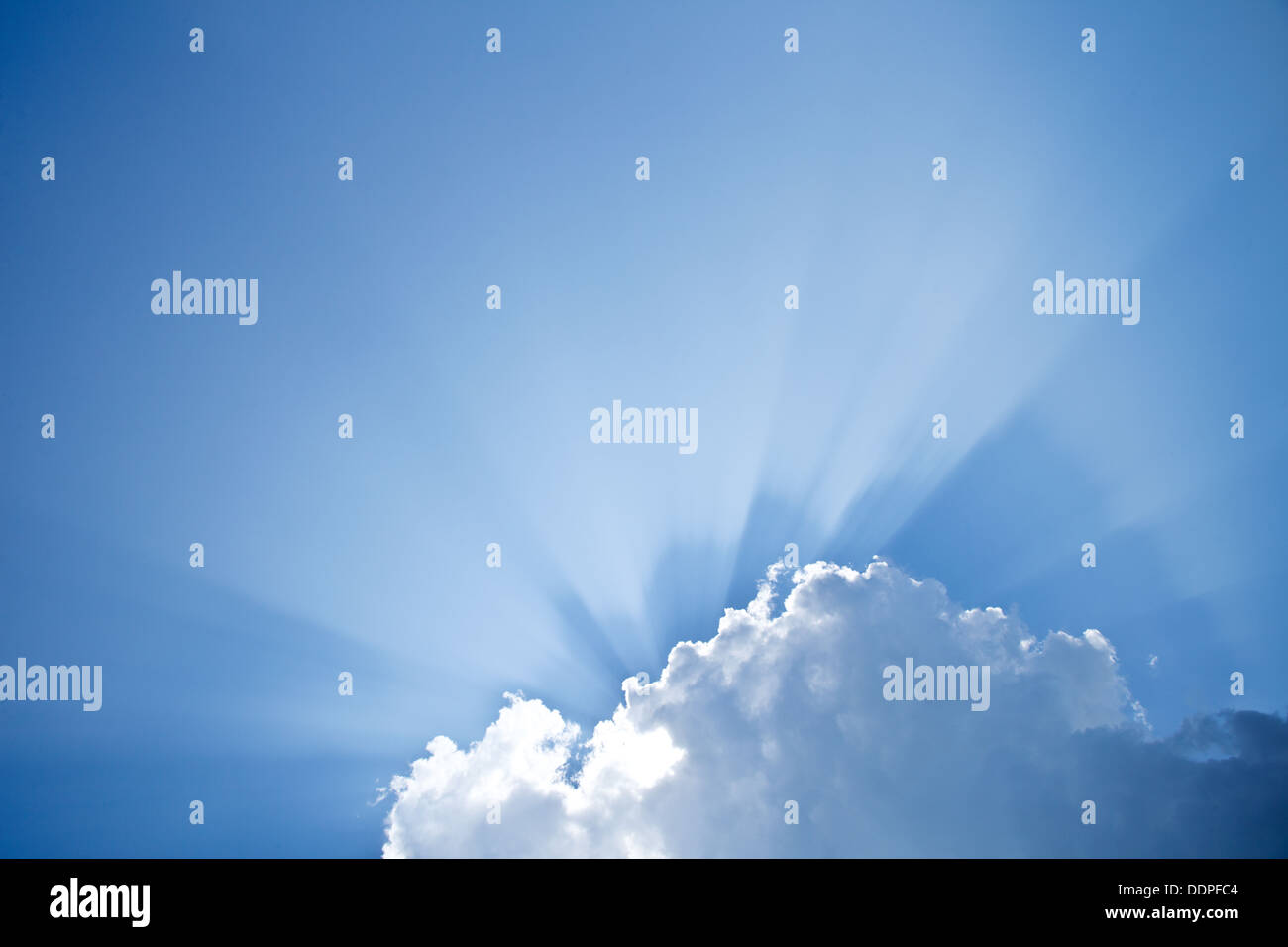 Rays of the sun peeking from behind the clouds Stock Photo - Alamy