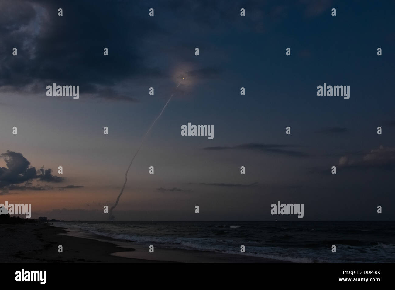 Delta IV rocket launch at dusk, taken from the beach in Cocoa Beach, Florida Stock Photo