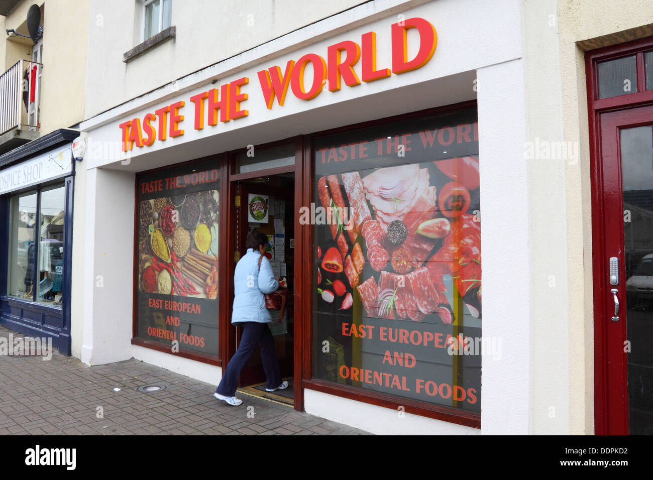 Woman shopper entering 'Taste the World' international grocery store in ...