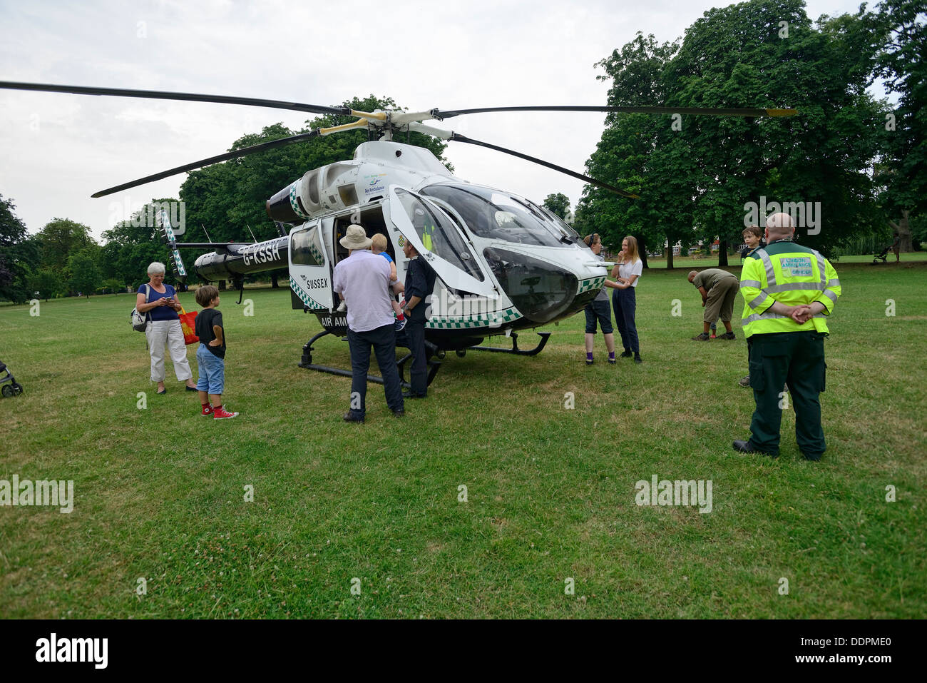 Emergency services helicopter in one of many London parks Stock Photo