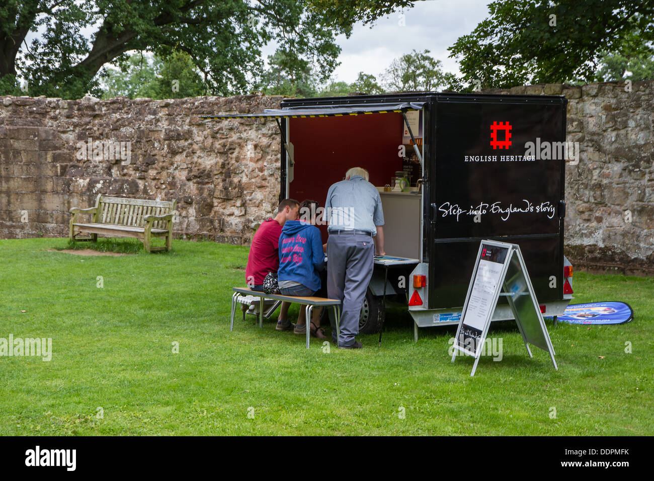 A young couple joining up for a membership to English Heritage Stock Photo