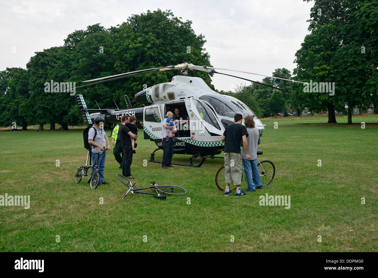 Emergency services helicopter in one of many London parks Stock Photo